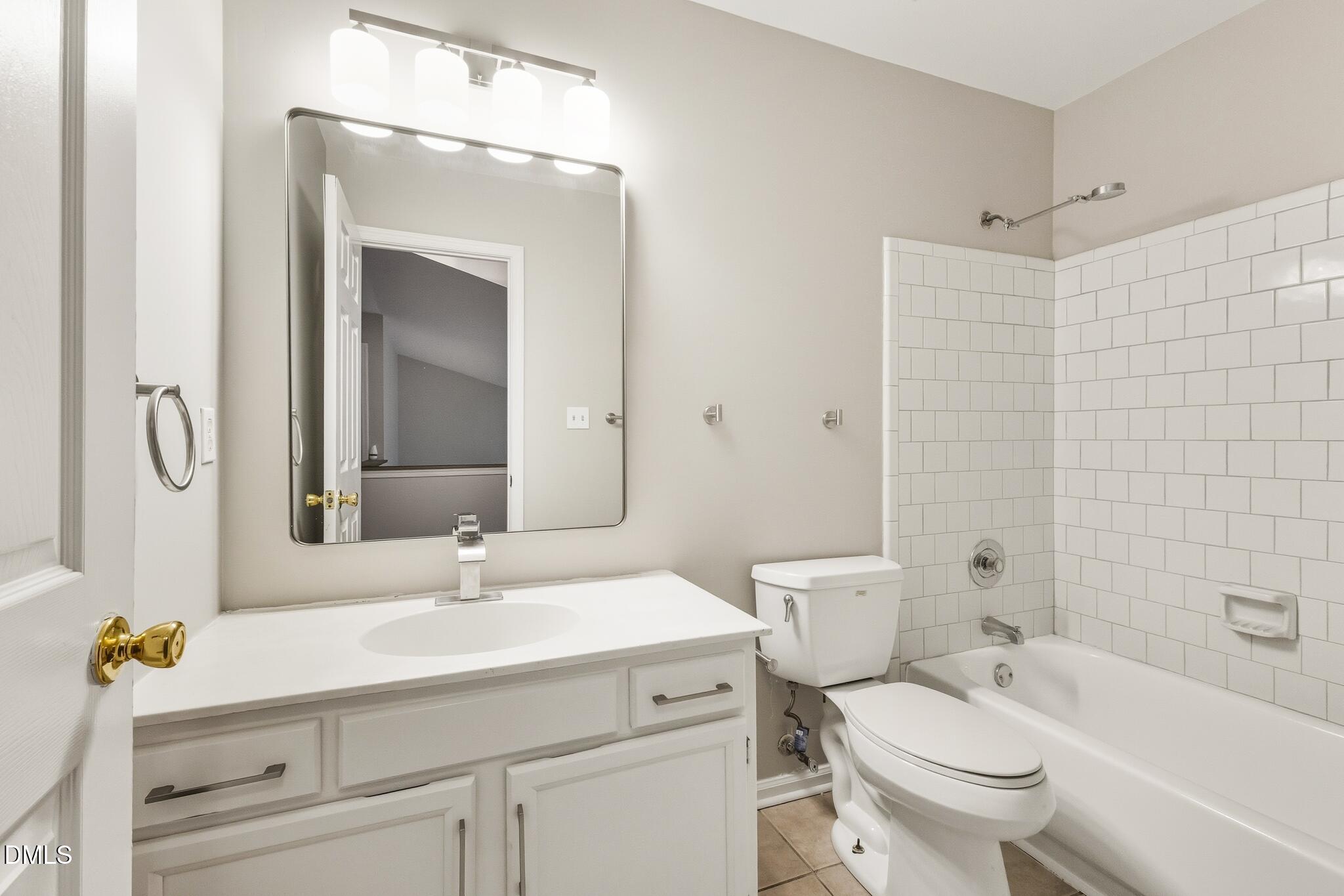4412 Birmingham Way Raleigh, NC 27604 - Photo 29 of 41 a bathroom with a sink toilet vanity and shower