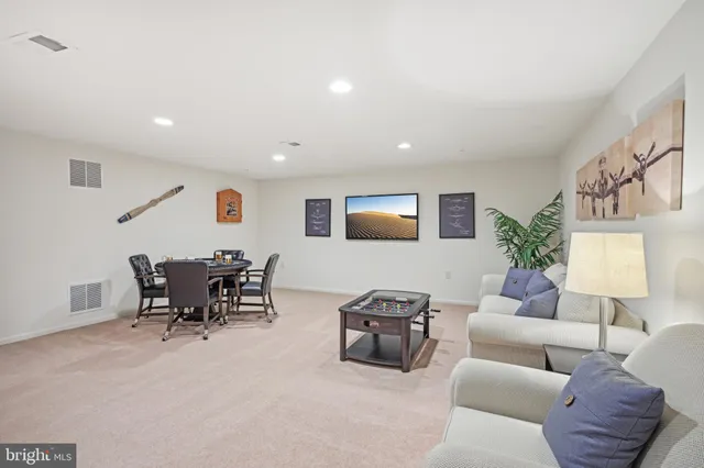 a living room with furniture and a table