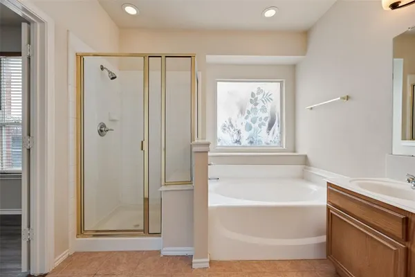 a bathroom with a bathtub and shower