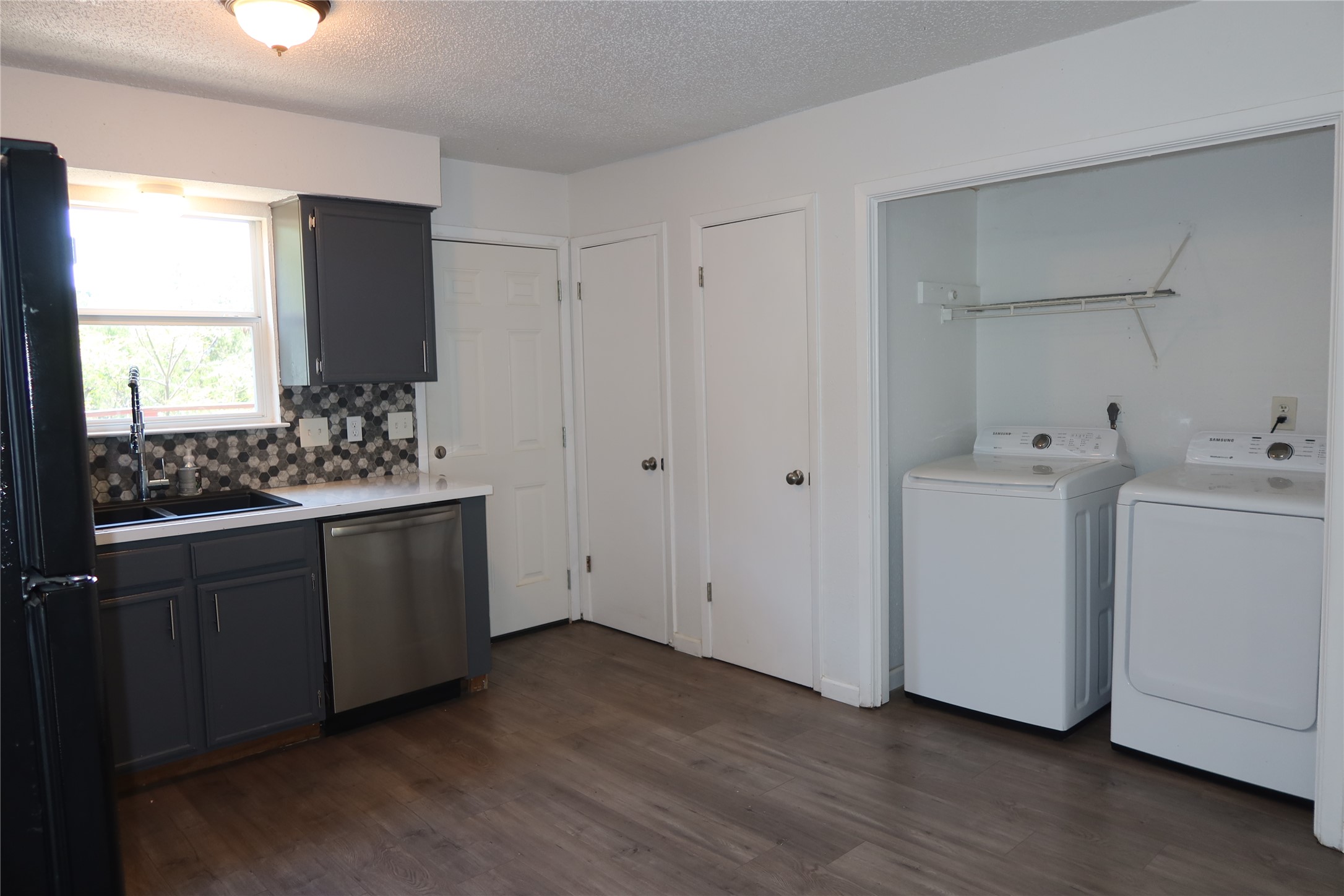 6914 Rifle Bend, Unit A Austin, TX 78736 - Photo 9 of 25 Functional layout unites a modern kitchen prep area with convenient laundry facilities.