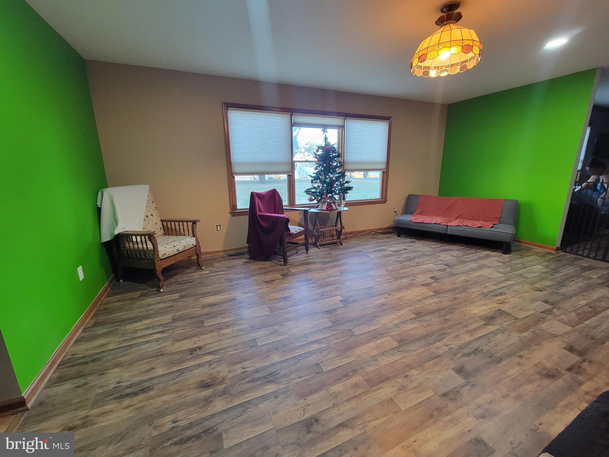 49993 Airedele Road Ridge, MD 20680 - Photo 13 of 34 Spacious living room on front of house