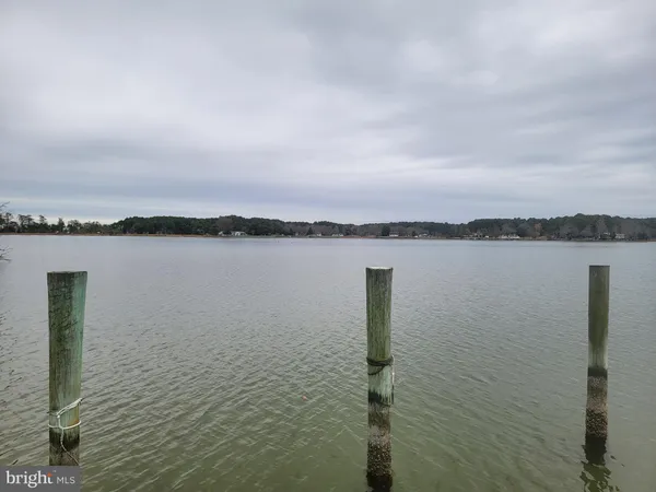 a kitchen with stainless steel appliances a sink a stove a microwave a sink and cabinets