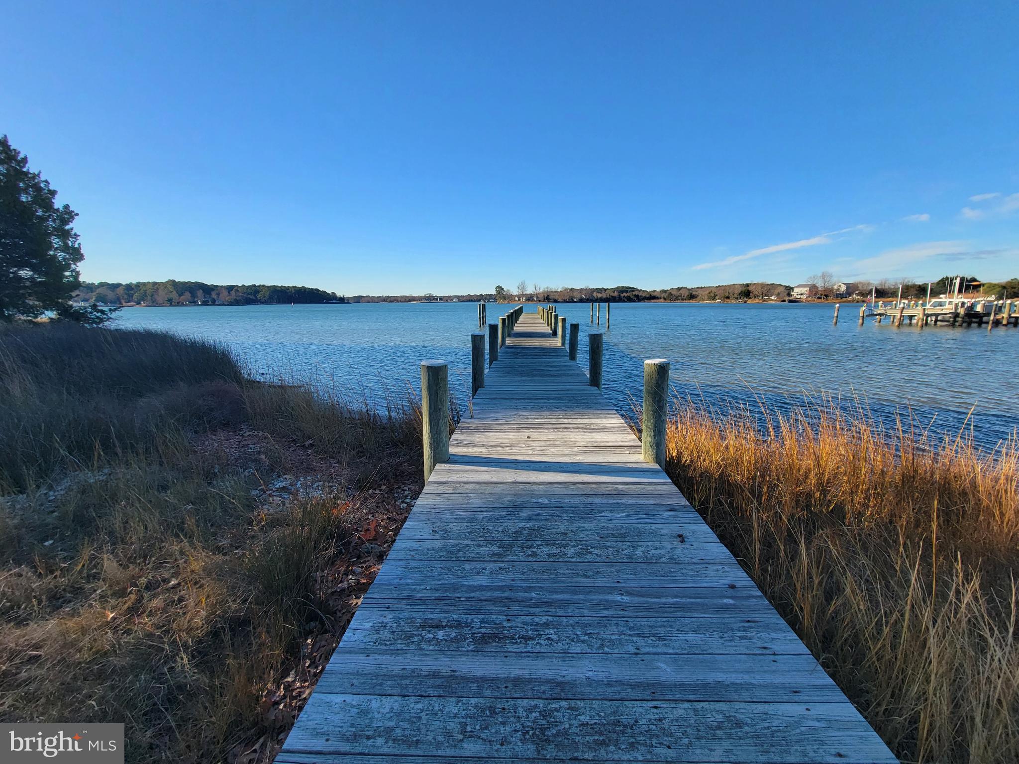 49993 Airedele Road Ridge, MD 20680 - Photo 26 of 34 Tranquil dock leading to serene waters.