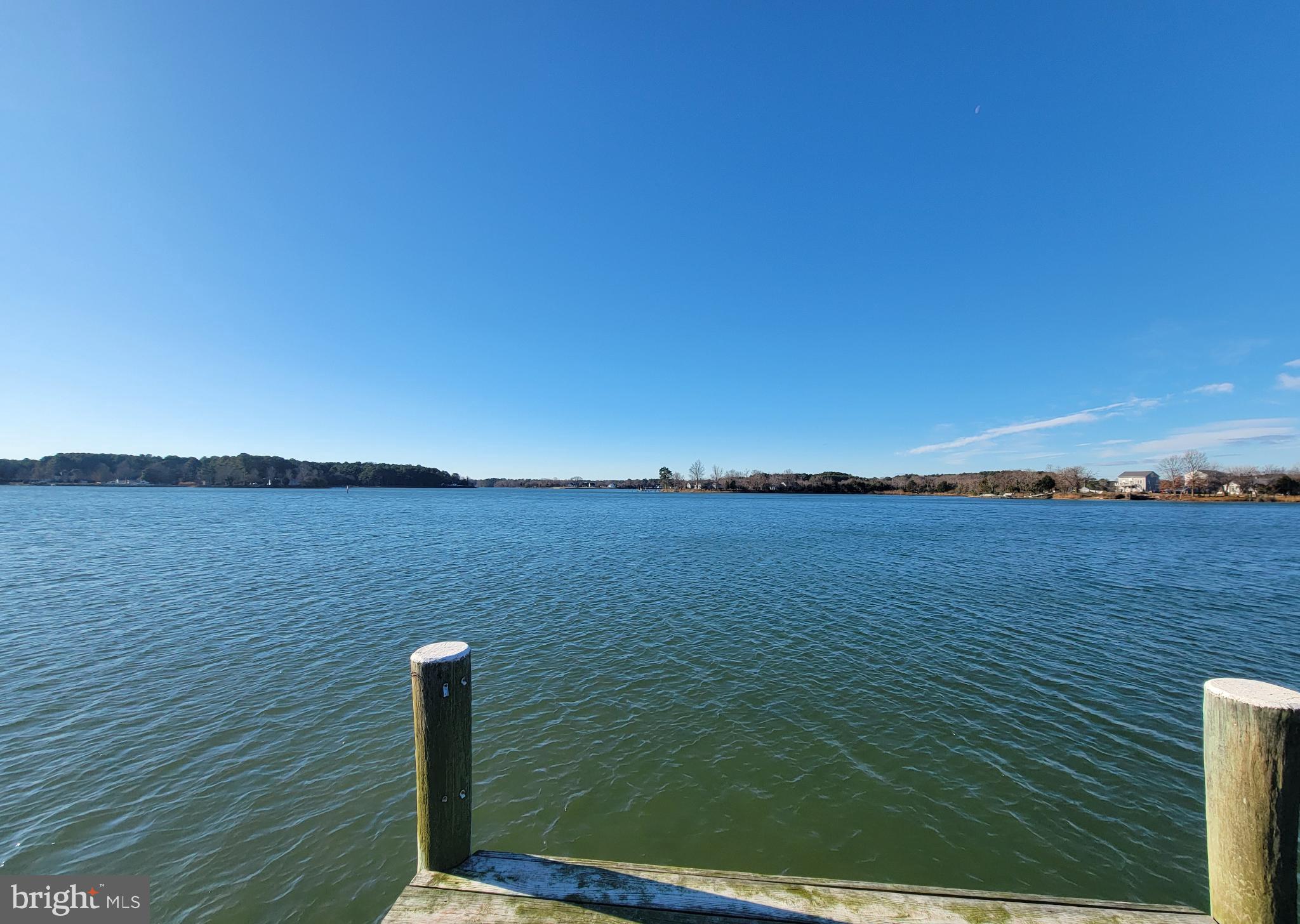 49993 Airedele Road Ridge, MD 20680 - Photo 27 of 34 Tranquil waters under a clear blue sky.