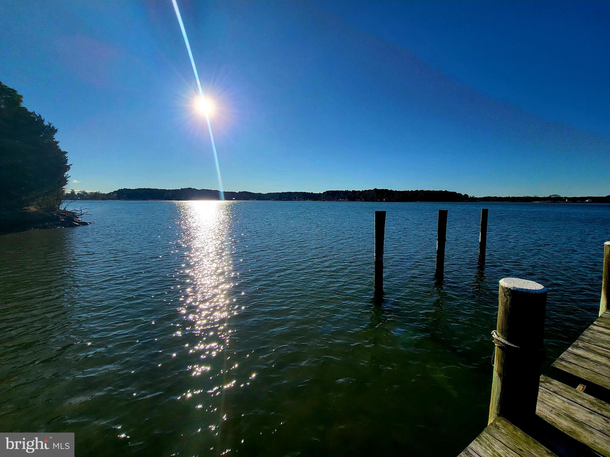 49993 Airedele Road Ridge, MD 20680 - Photo 29 of 34 Sunlit serenity over tranquil waters.