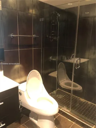 a bathroom with a toilet and a sink