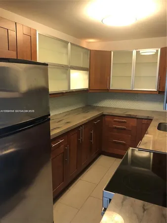 a kitchen with a sink and a window