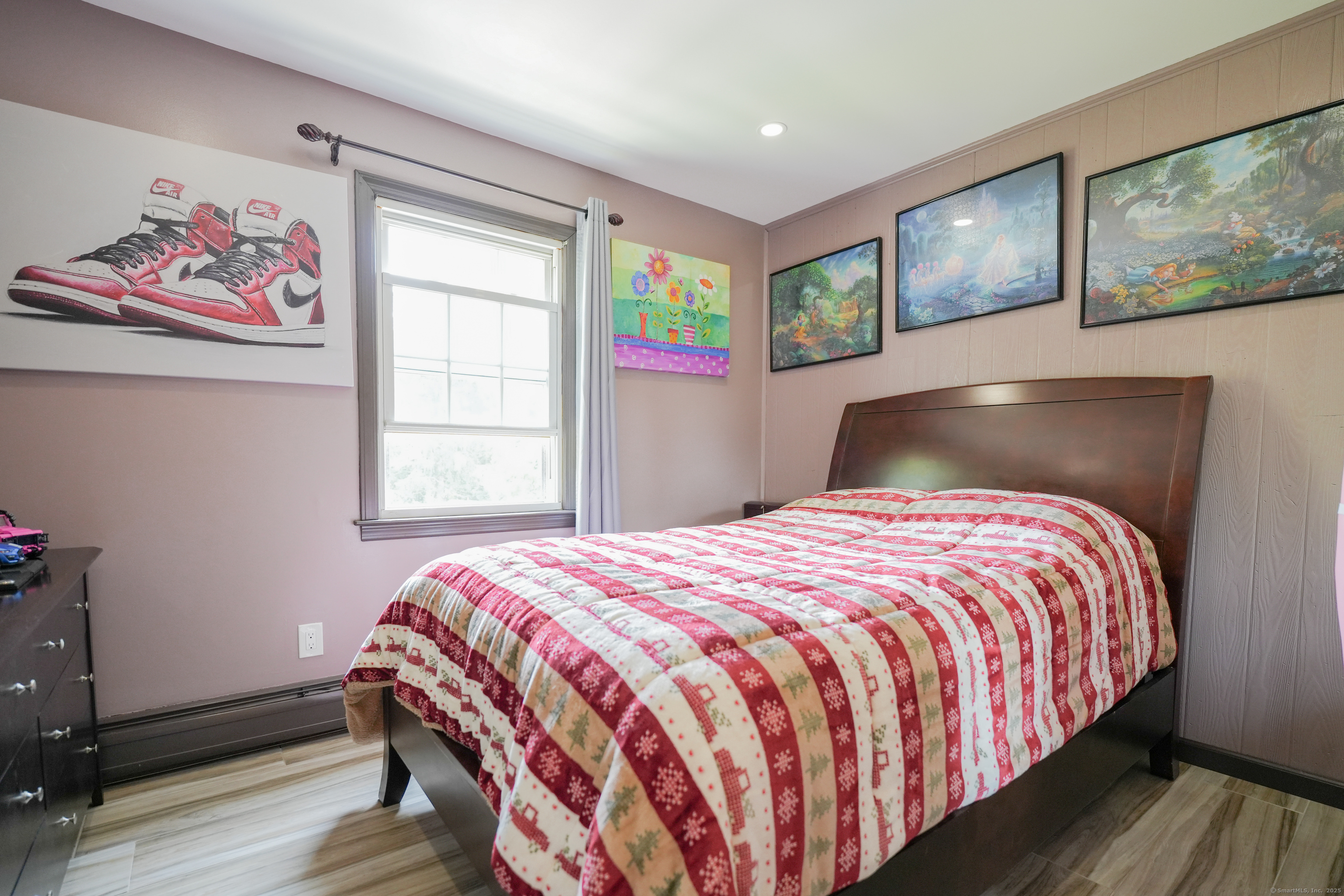 22 Standish Road New Milford, CT 06776 - Photo 3 of 11 a bedroom with a bed and painting on the wall