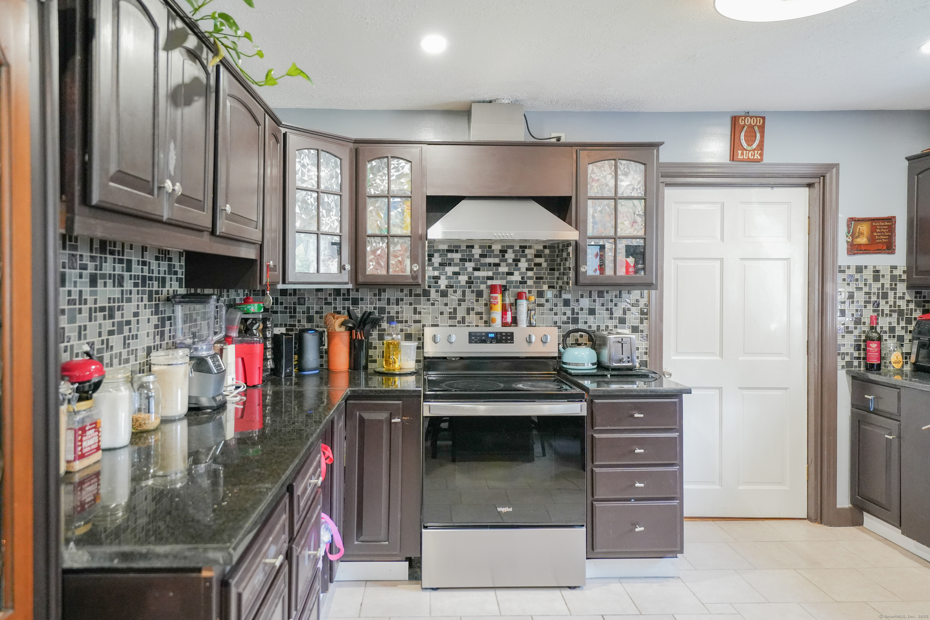 22 Standish Road New Milford, CT 06776 - Photo 4 of 11 a kitchen with stainless steel appliances granite countertop a sink and cabinets
