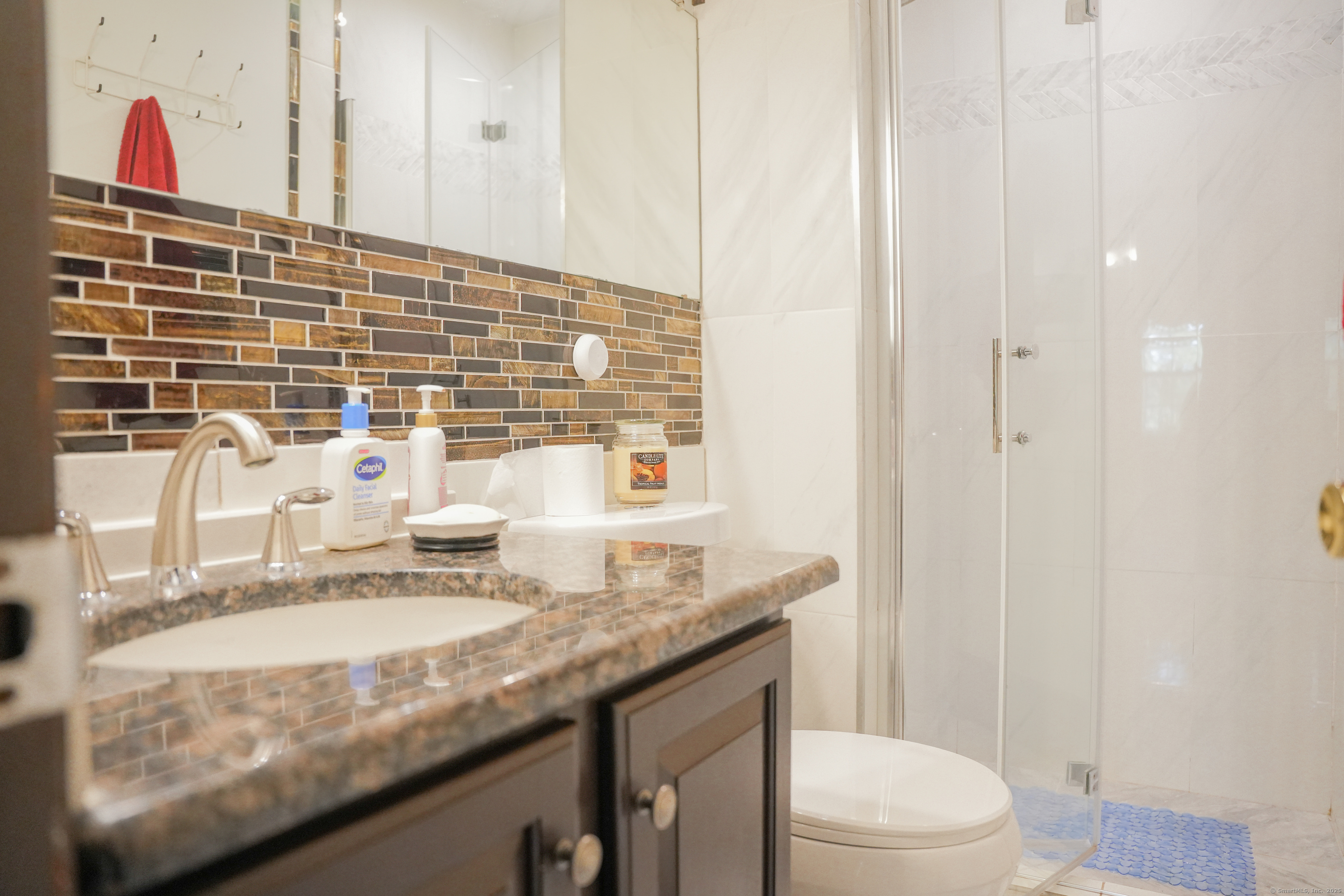 22 Standish Road New Milford, CT 06776 - Photo 5 of 11 a bathroom with a granite countertop sink a toilet and a mirror