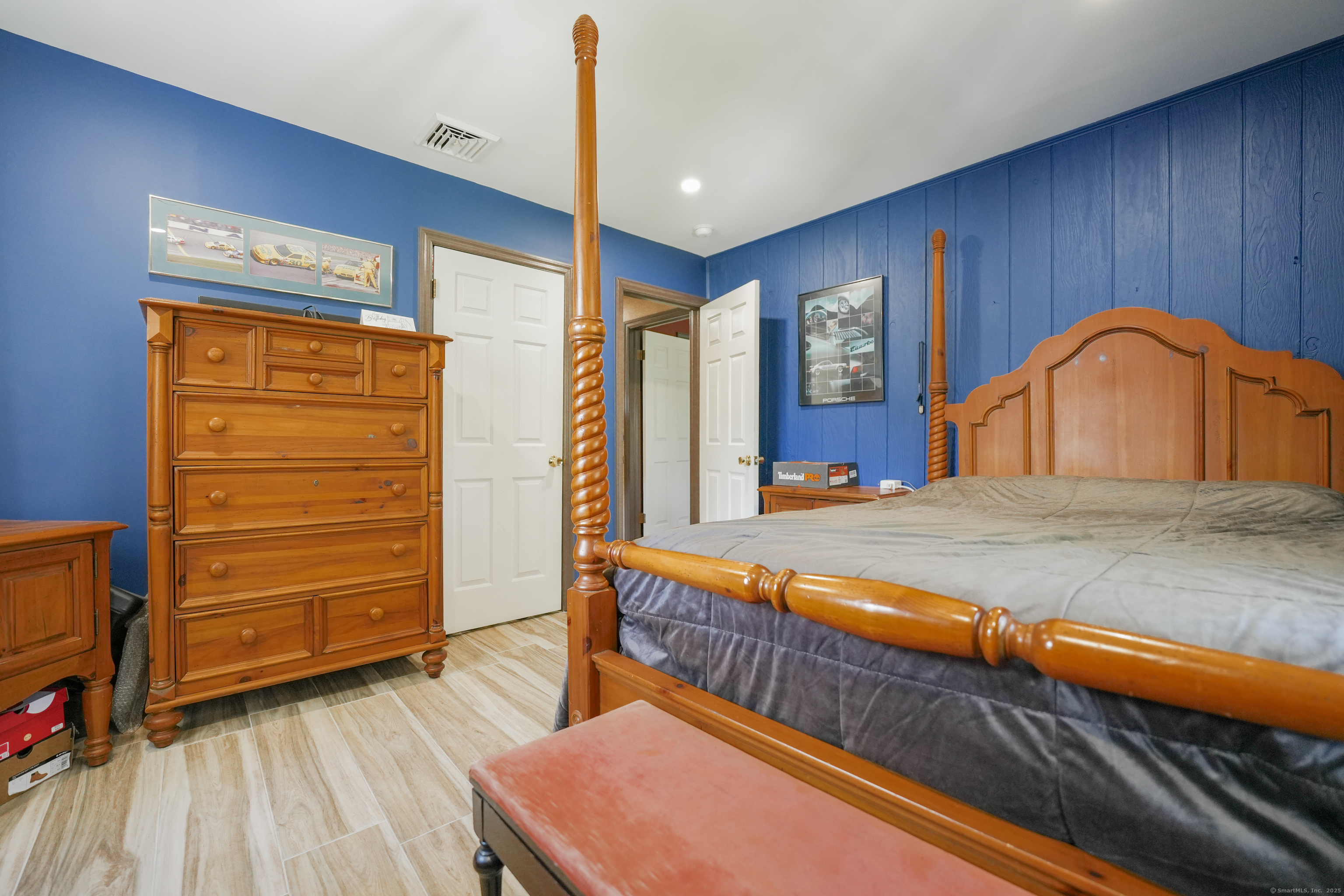 22 Standish Road New Milford, CT 06776 - Photo 7 of 11 a bedroom with a bed and a dresser