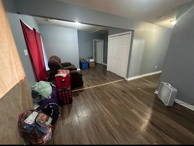 a room with furniture and wooden floor