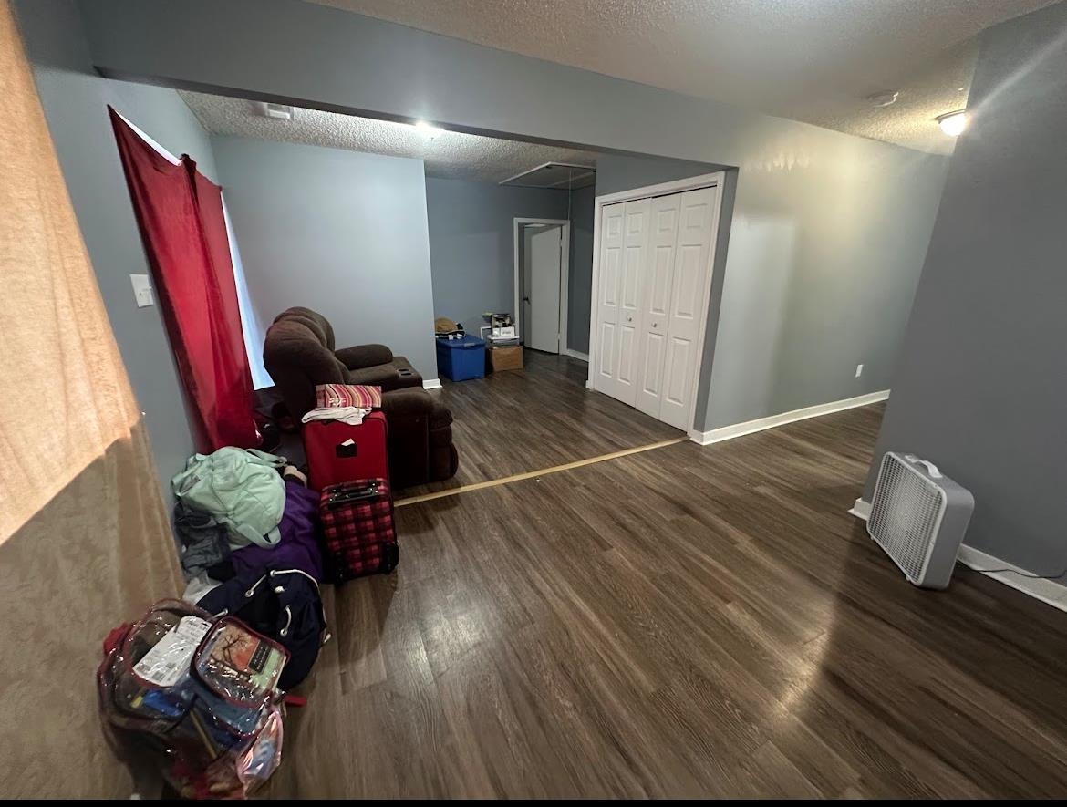 a room with furniture and wooden floor