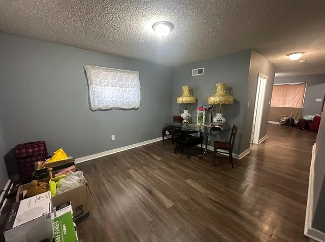 a kitchen that has a sink and a stove in it