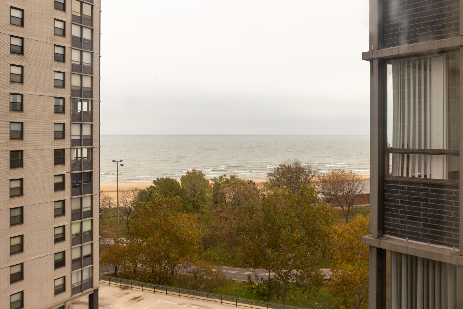 5701 North Sheridan Road, Unit 9N Chicago, IL 60660 - Photo 4 of 17 a view of a balcony with an ocean view