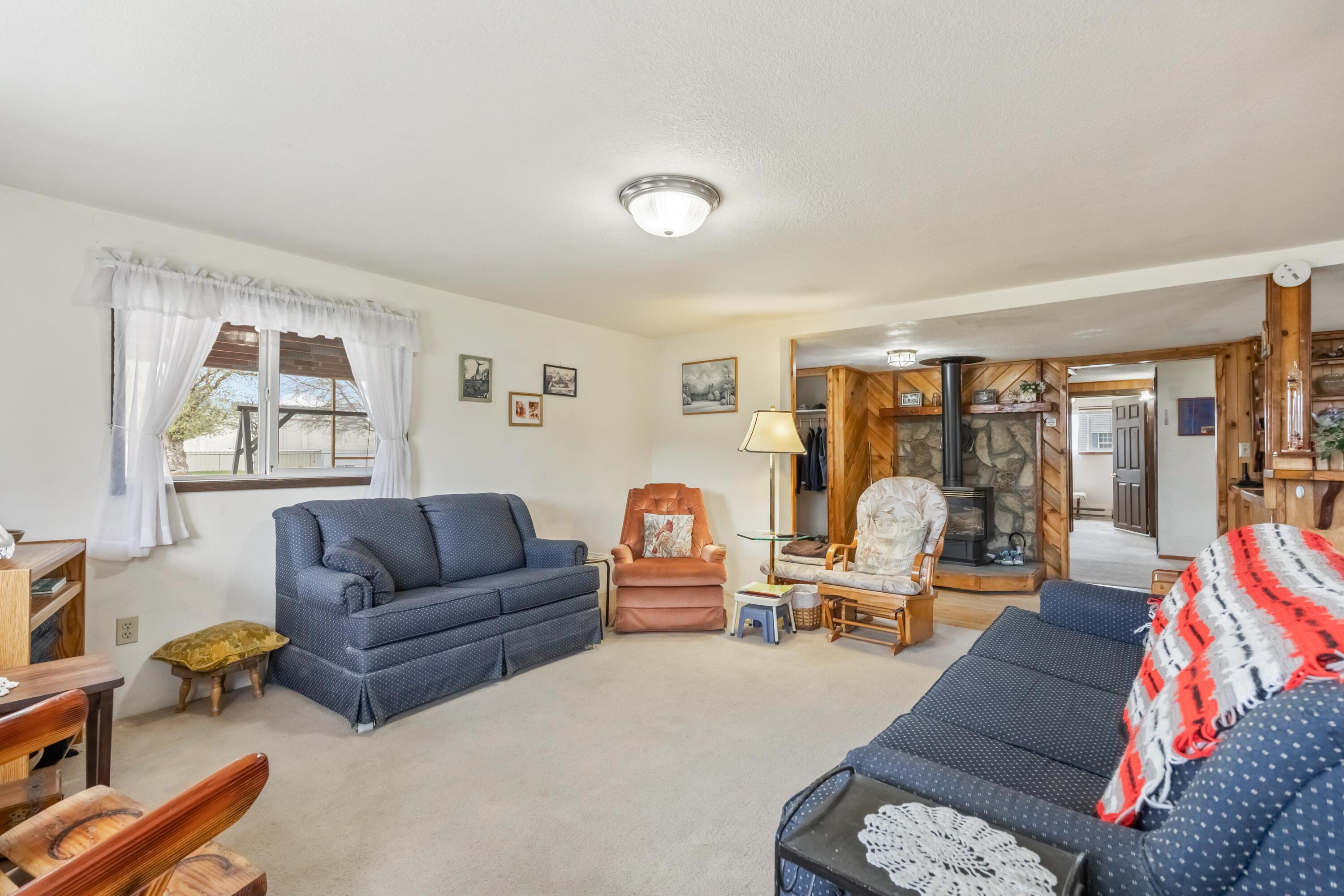 2010 Northeast Laughlin Road Prineville, OR 97754 - Photo 6 of 39 a living room with furniture and a flat screen tv