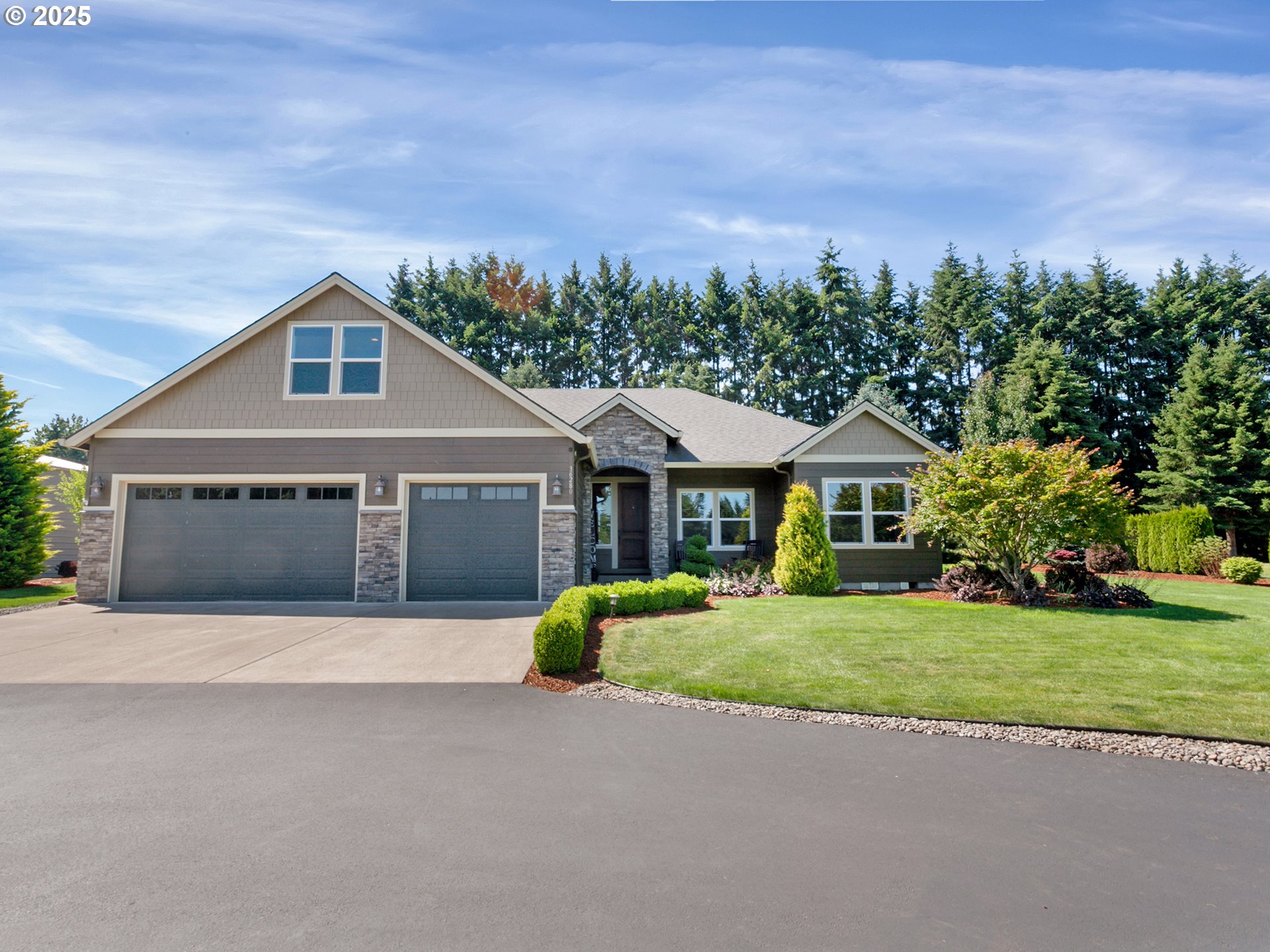 36280 Southeast Hauglum Road Sandy, OR 97055 - Photo 2 of 31 a front view of a house with a garden and trees