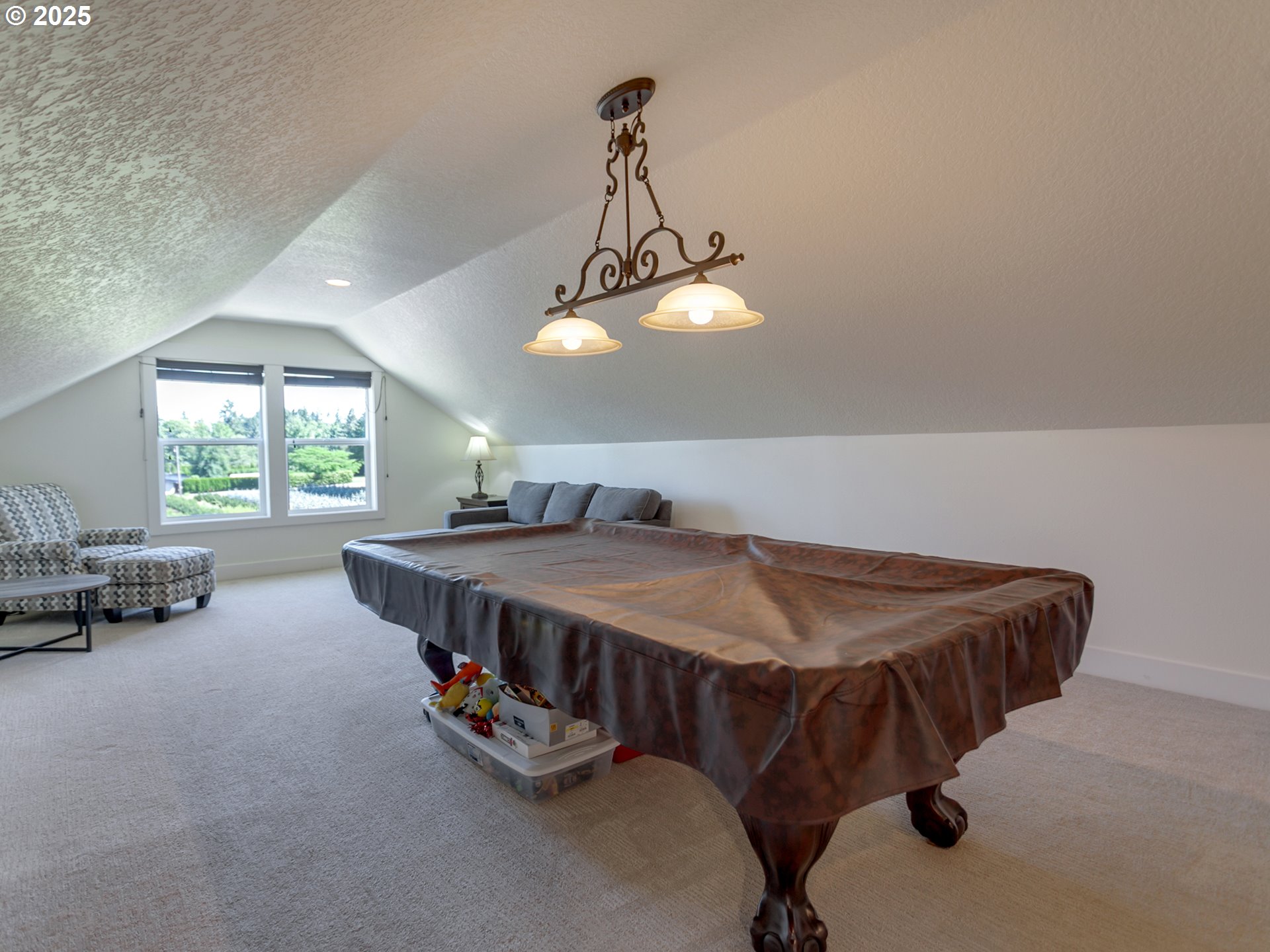 36280 Southeast Hauglum Road Sandy, OR 97055 - Photo 21 of 31 a bed room with a bed and a chandelier