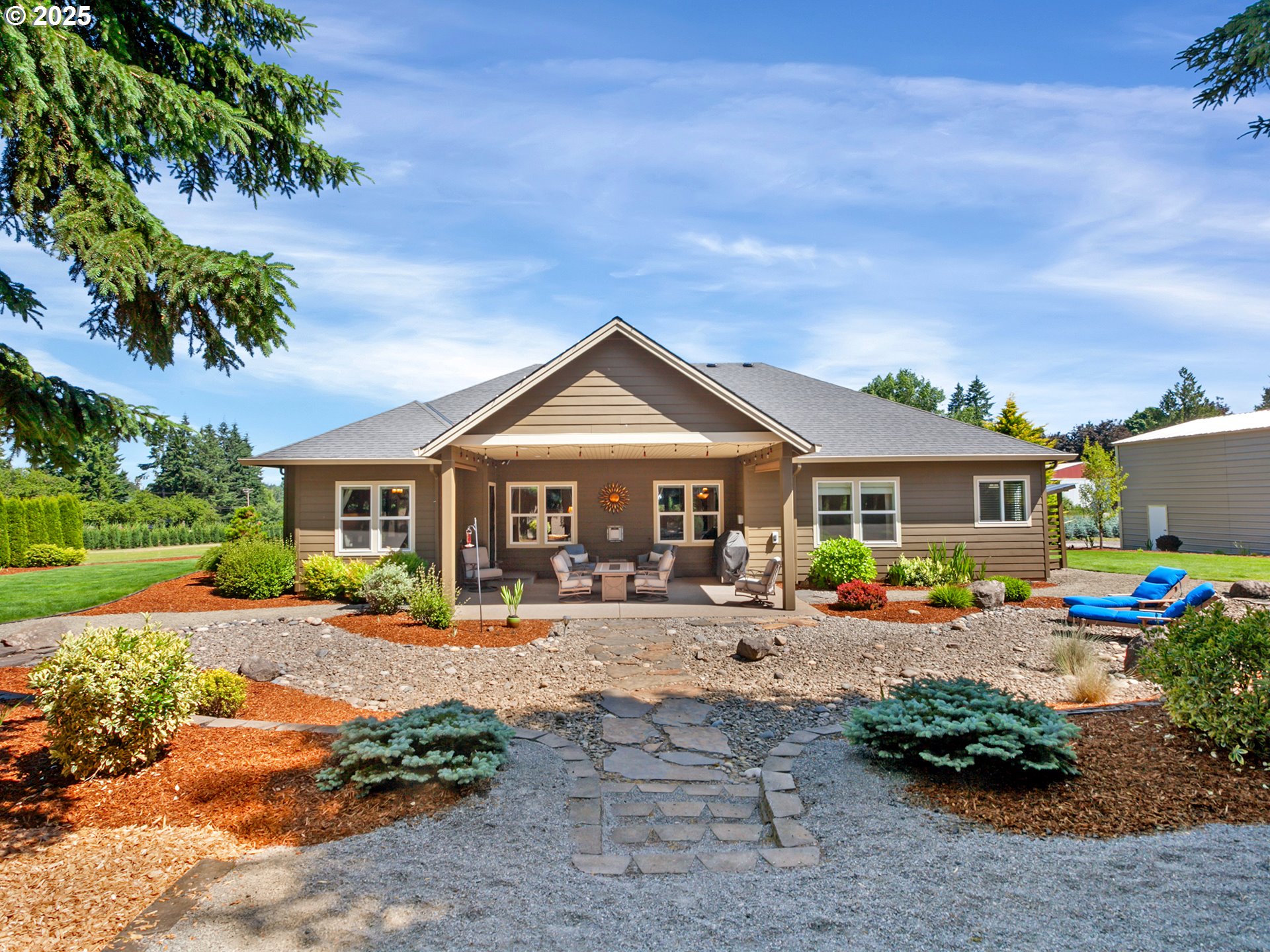 36280 Southeast Hauglum Road Sandy, OR 97055 - Photo 25 of 31 a front view of a house with garden