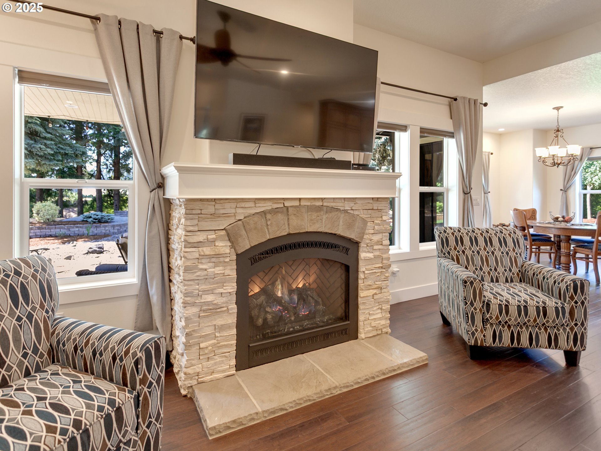 36280 Southeast Hauglum Road Sandy, OR 97055 - Photo 6 of 31 a living room with furniture and a fireplace