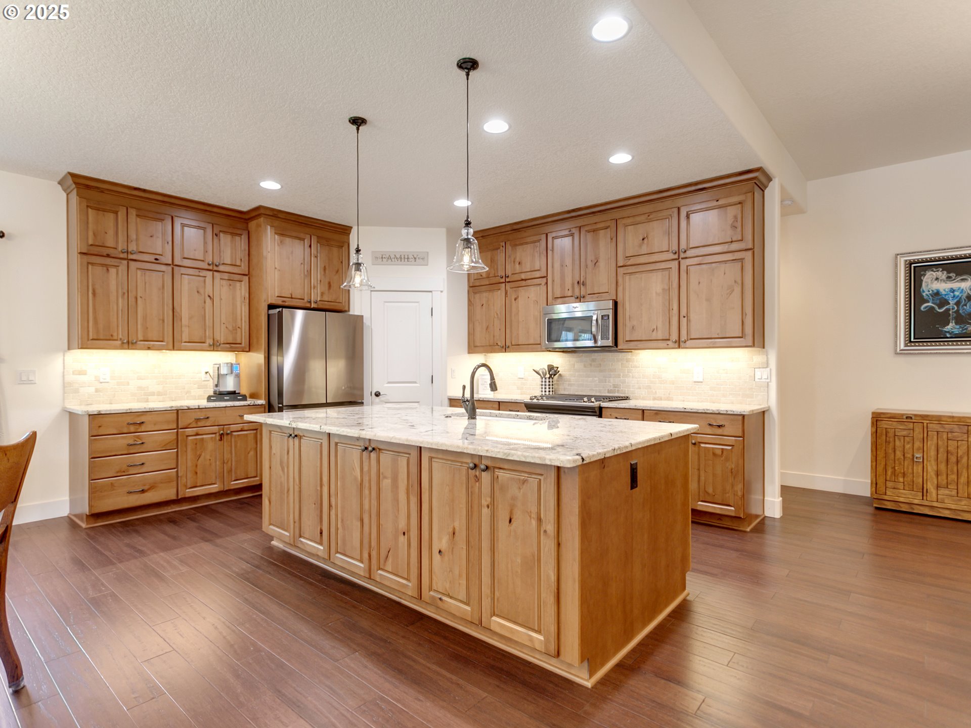 36280 Southeast Hauglum Road Sandy, OR 97055 - Photo 8 of 31 a kitchen with stainless steel appliances granite countertop a sink a stove a refrigerator cabinets and wooden floor