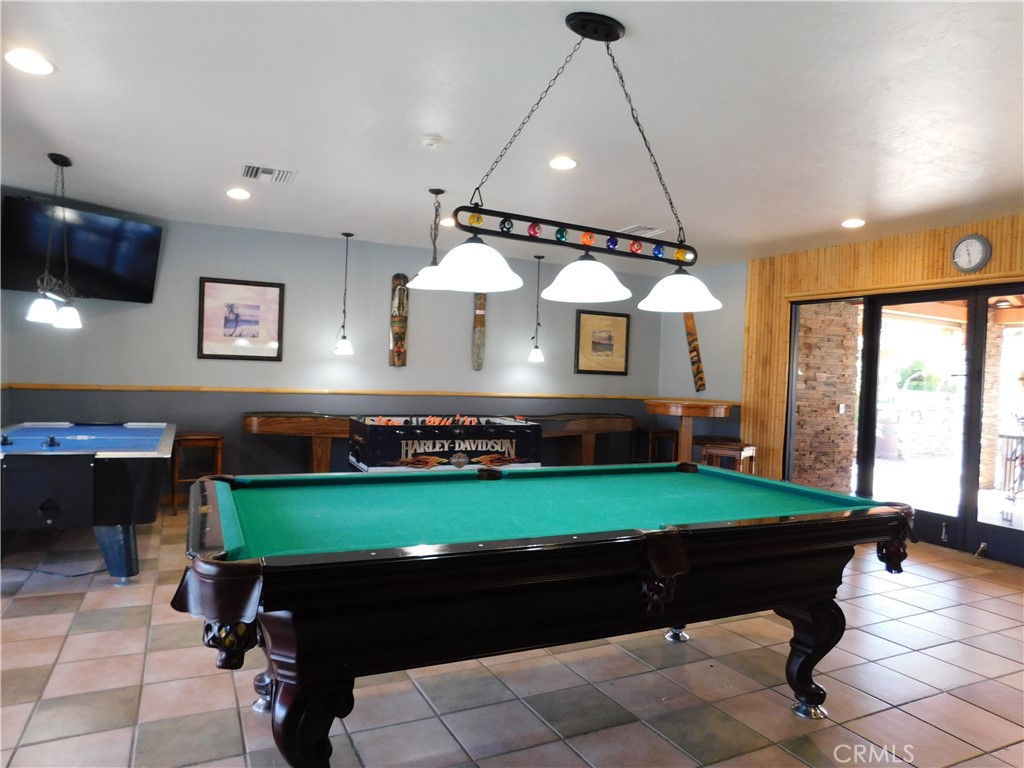 4170 Needles Highway, Unit 55 Needles, CA 92363 - Photo 25 of 39 a room with pool table and outdoor seating