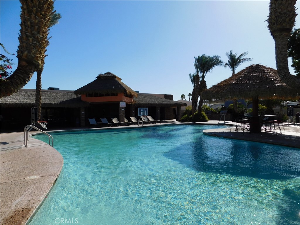 4170 Needles Highway, Unit 55 Needles, CA 92363 - Photo 27 of 39 a front view of a house with garden
