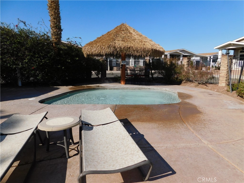 4170 Needles Highway, Unit 55 Needles, CA 92363 - Photo 29 of 39 a view of a table and chairs under an umbrella
