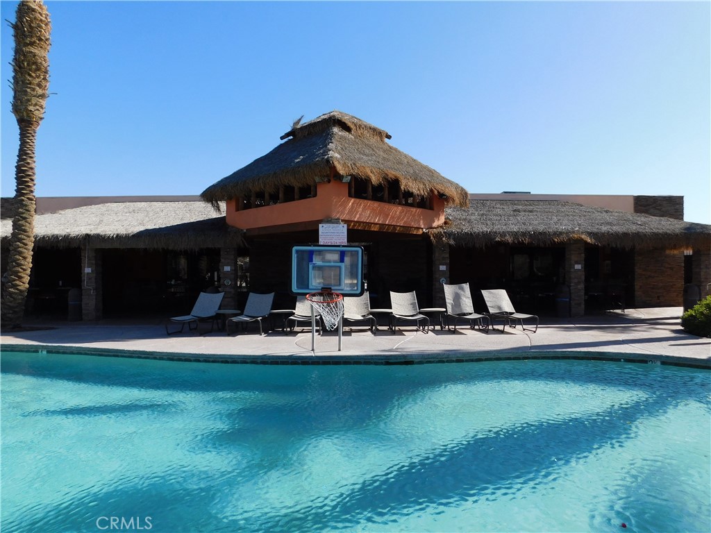 4170 Needles Highway, Unit 55 Needles, CA 92363 - Photo 30 of 39 a view of a house with swimming pool and sitting area