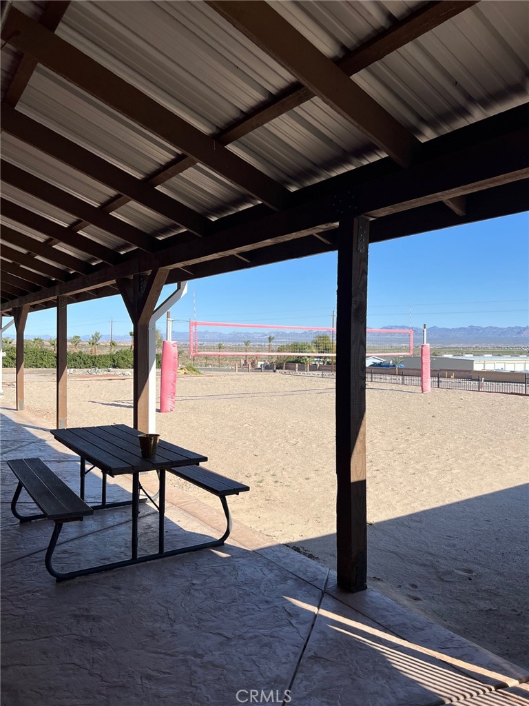 4170 Needles Highway, Unit 55 Needles, CA 92363 - Photo 34 of 39 a view of a hallway with wooden floor