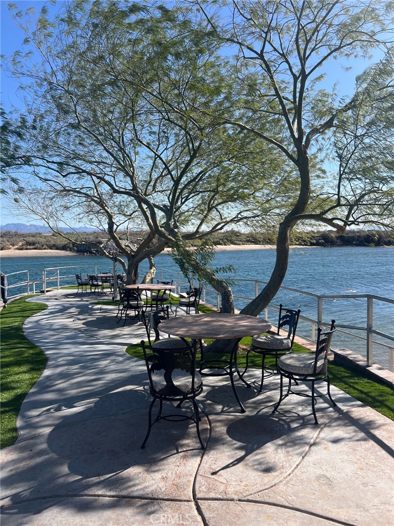 4170 Needles Highway, Unit 55 Needles, CA 92363 - Photo 37 of 39 a view of a dinning table and chairs in the patio