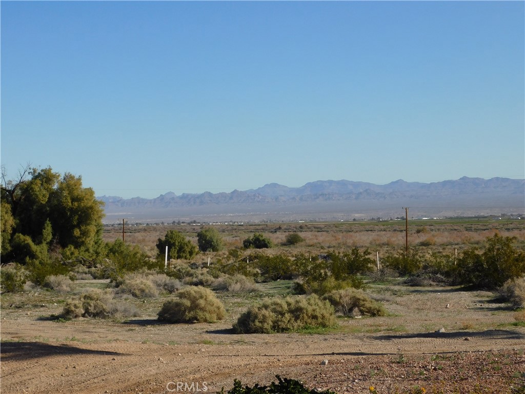 4170 Needles Highway, Unit 55 Needles, CA 92363 - Photo 6 of 39 a view of a town with mountains in the background