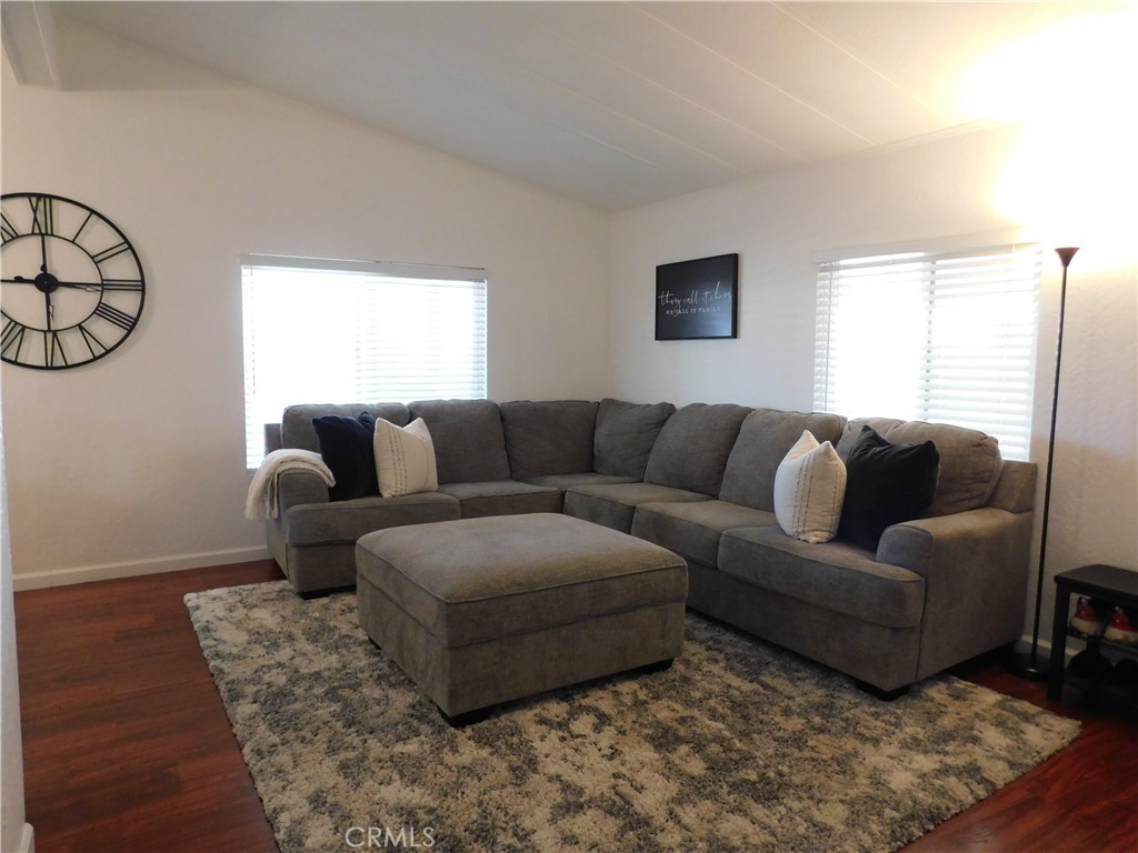 4170 Needles Highway, Unit 55 Needles, CA 92363 - Photo 7 of 39 a living room with furniture white walls and a couch