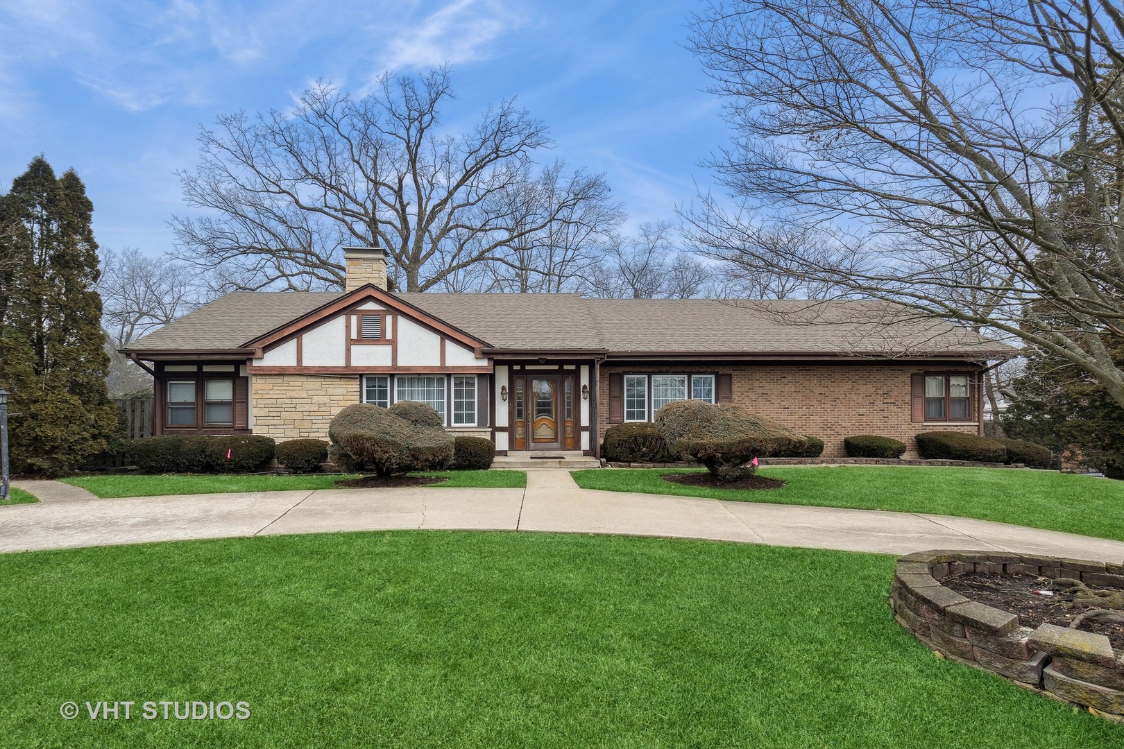 835 Heather Road Deerfield, IL 60015 - Photo 2 of 29 a front view of a house with a garden and yard