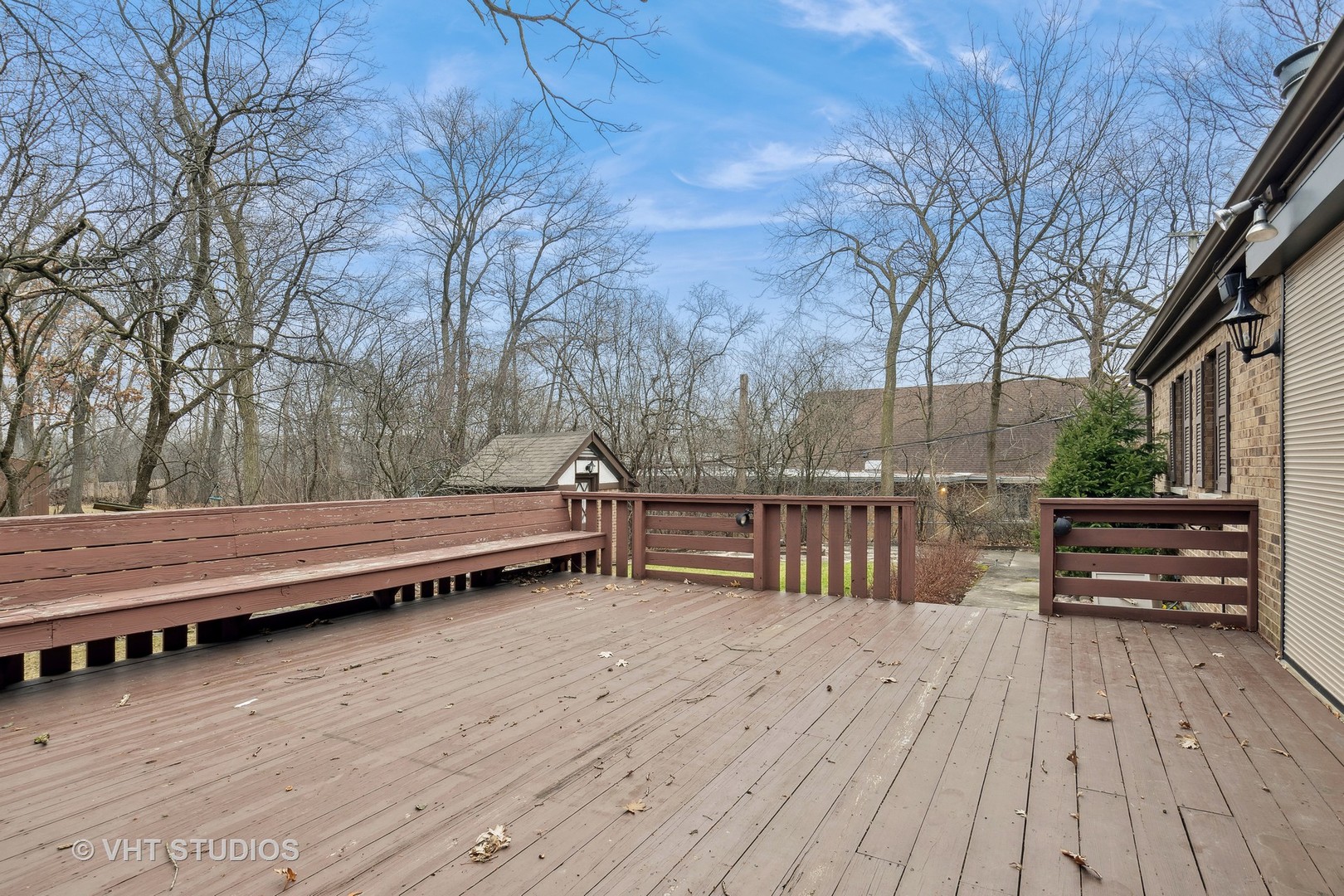 835 Heather Road Deerfield, IL 60015 - Photo 23 of 29 a view of a wooden deck with a bench