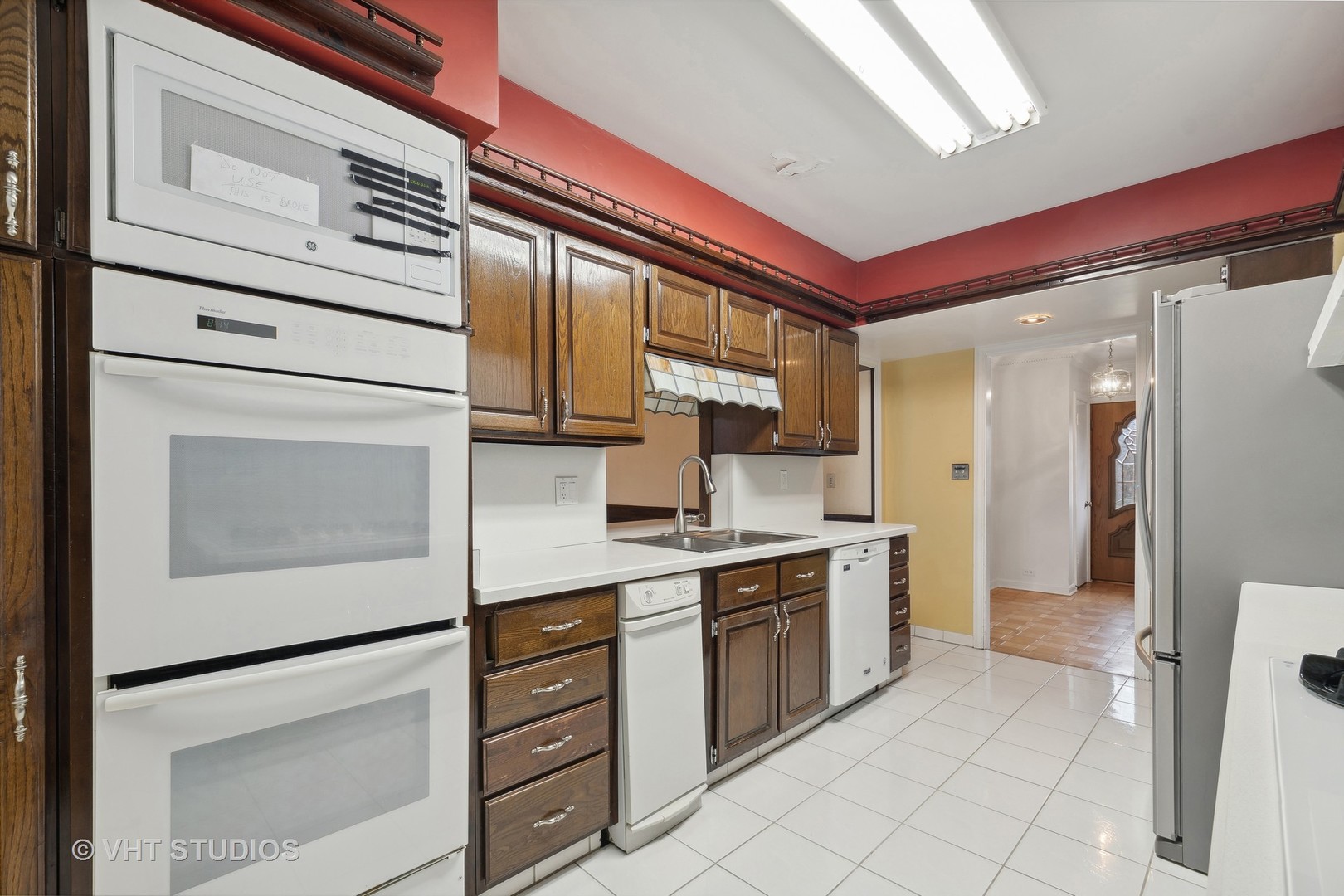 835 Heather Road Deerfield, IL 60015 - Photo 5 of 29 a kitchen with stainless steel appliances cabinets and wooden floor