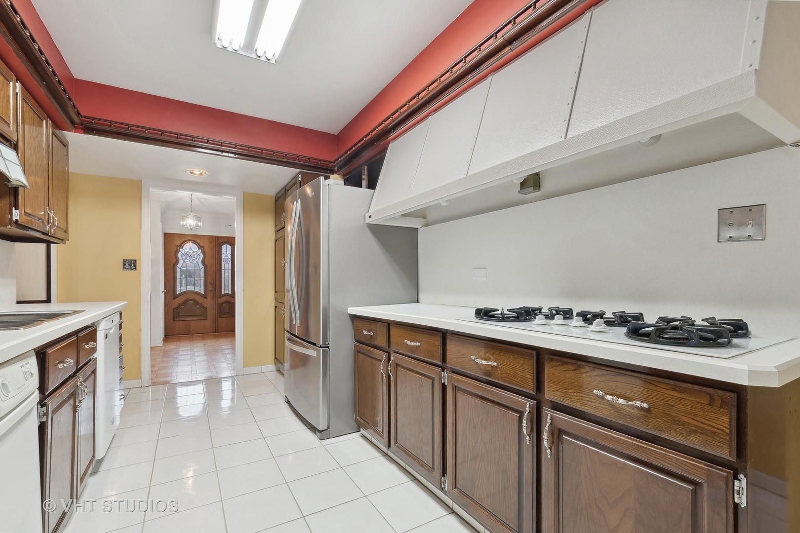 835 Heather Road Deerfield, IL 60015 - Photo 6 of 29 a kitchen with a stove and a refrigerator