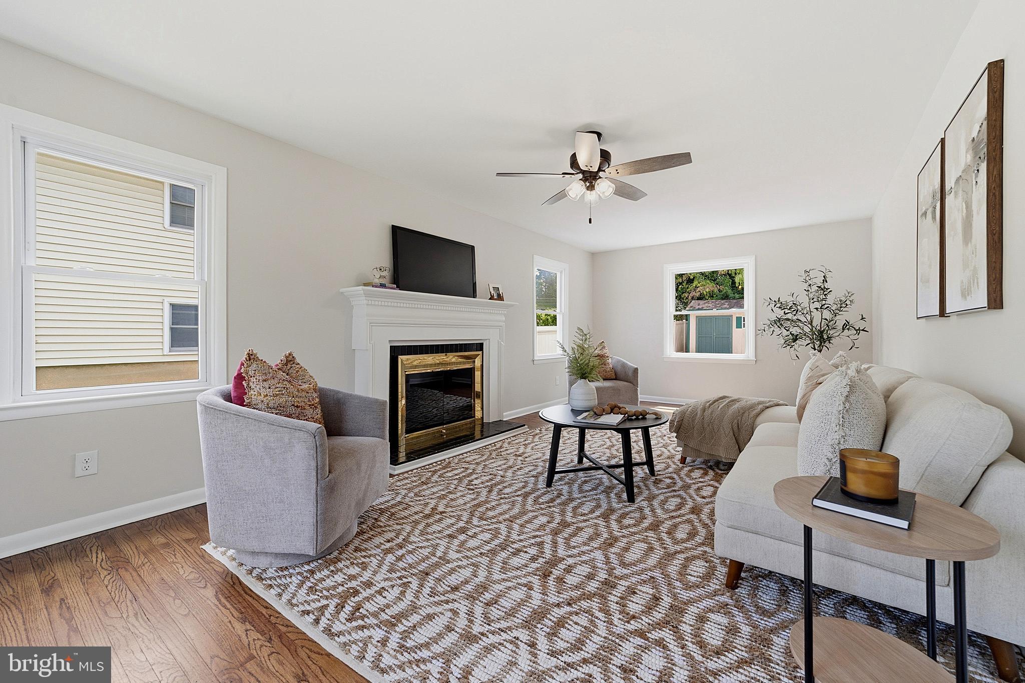 117 Harvest Road Cherry Hill, NJ 08002 - Photo 5 of 35 a living room with furniture and a fireplace