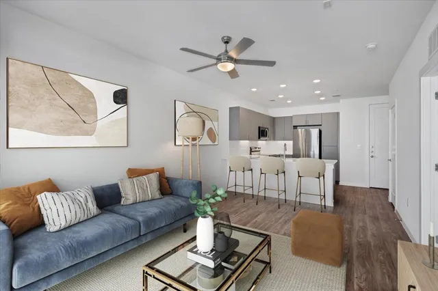 a living room with furniture and a large window