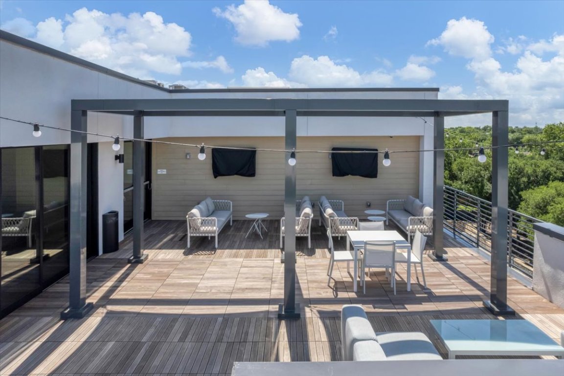 4801 Springdale Road, Unit 1402 Austin, TX 78723 - Photo 24 of 40 a dinning table and chairs in patio of the house