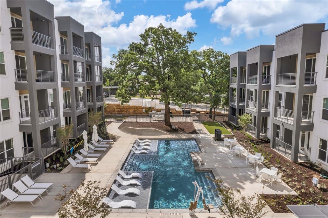 4801 Springdale Road, Unit 1402 Austin, TX 78723 - Photo 33 of 40 a view of a building with many windows
