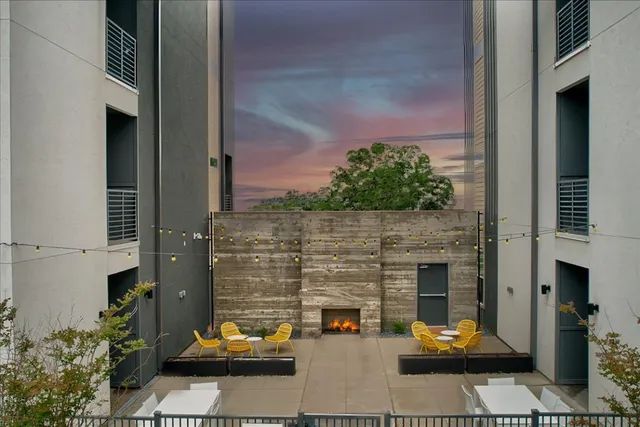 a couple of cars parked in front of building