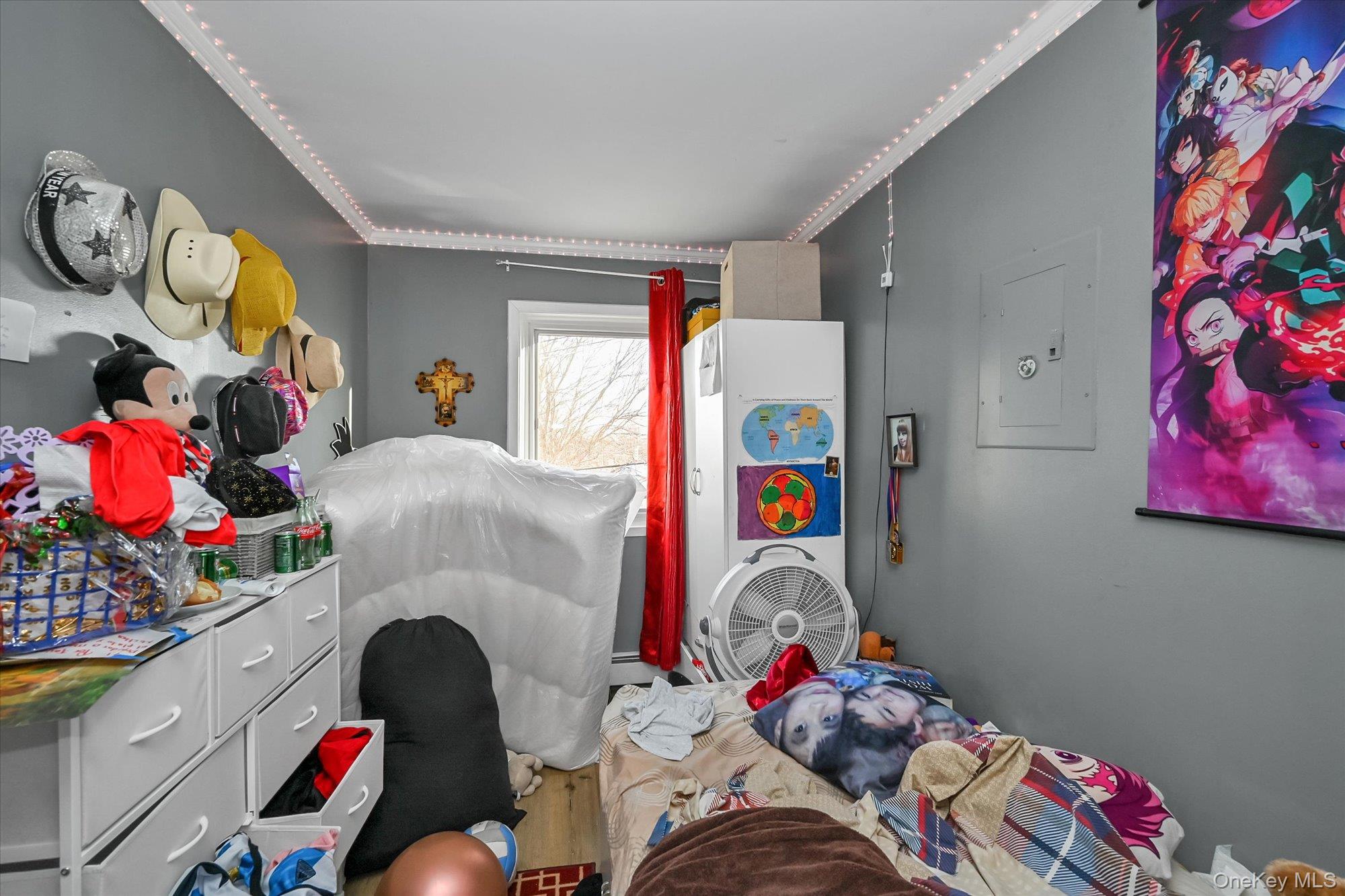 69-25 59th Road Queens, NY 11378 - Photo 15 of 24 Bedroom with electric panel and crown molding