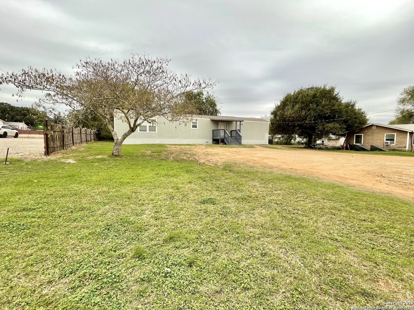 7970 1st Street Somerset, TX 78069 - Photo 1 of 32 a house view with swimming pool in front of it