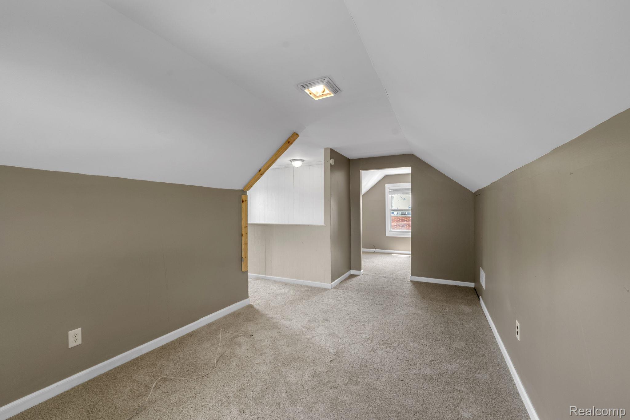 7641 Pelham Road Allen Park, MI 48101 - Photo 15 of 21 Finished attic space featuring neutral carpeting, sloped ceilings, and recessed lighting