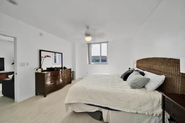 a bedroom with a bed and a dresser