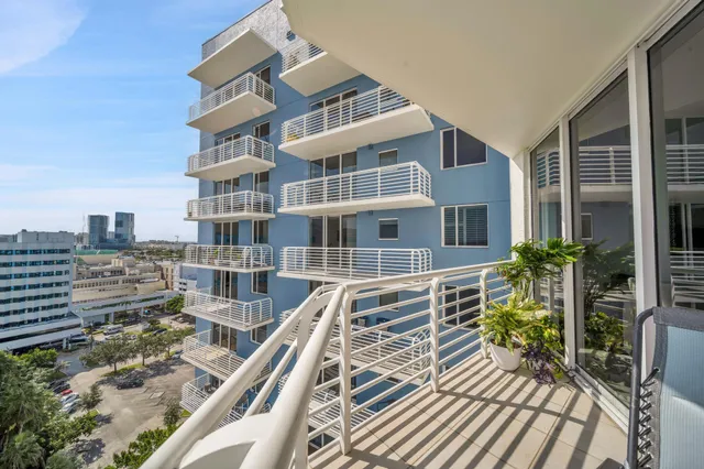 a view of buildings with wooden floor and seating space