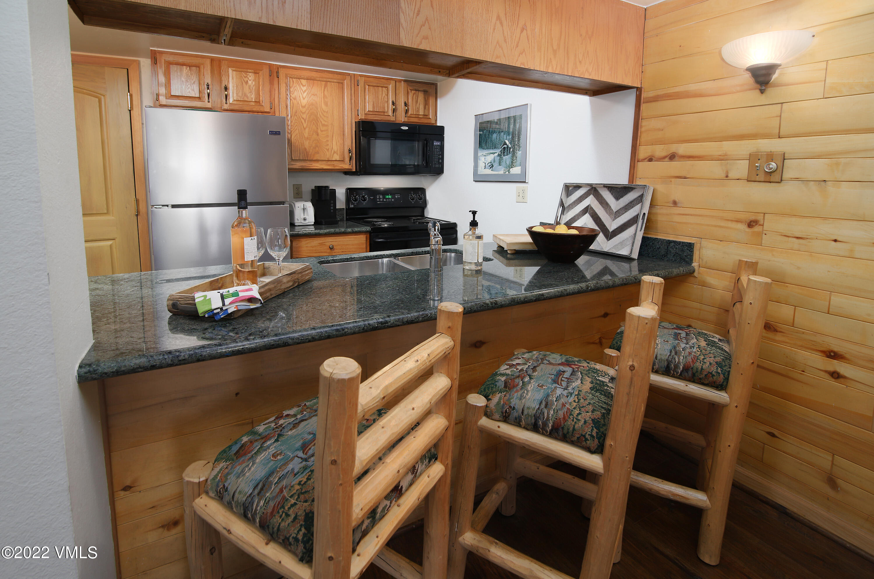9 Vail Road, Unit 15 Vail, CO 81657 - Photo 4 of 18 a kitchen with a sink cabinets and appliances