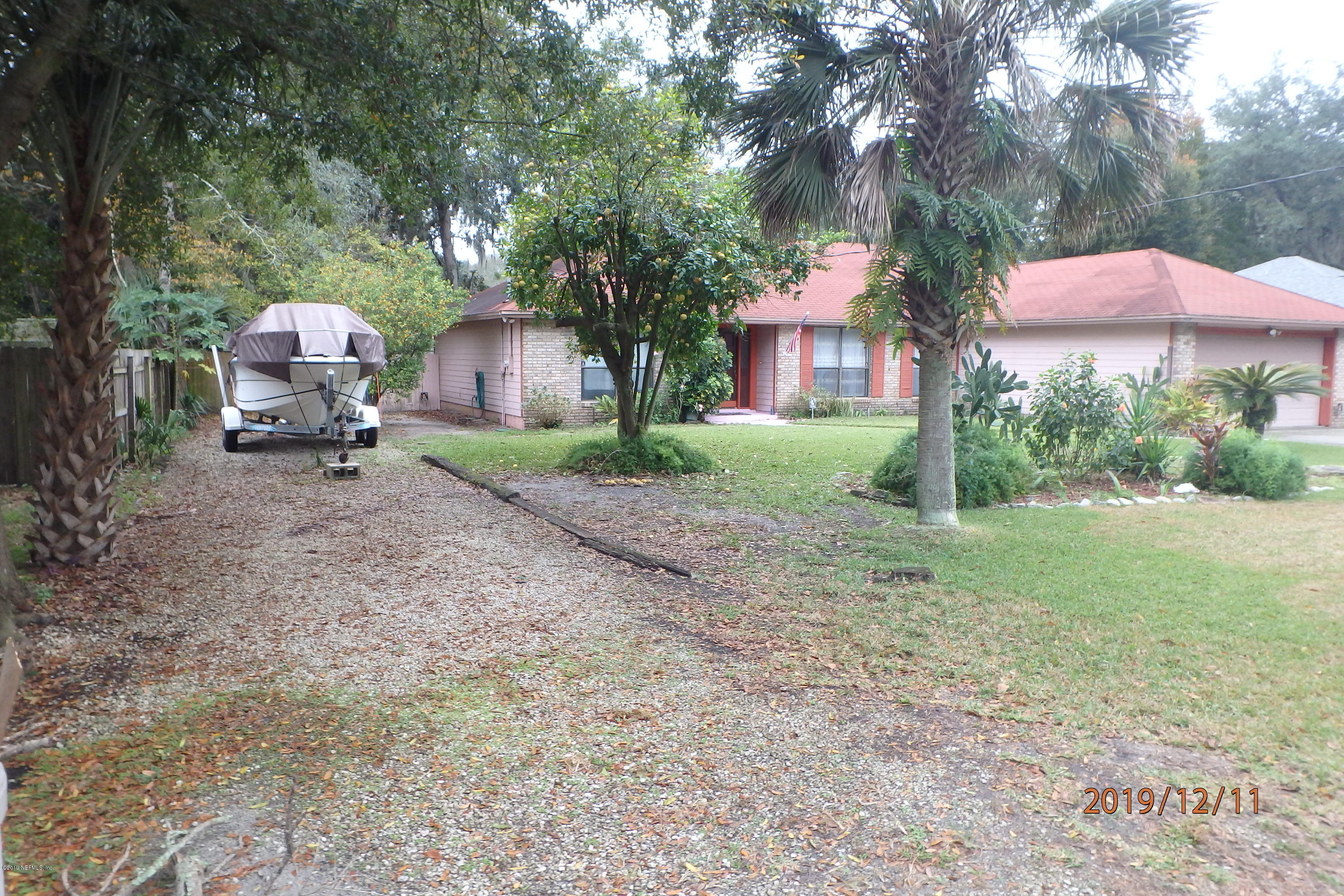 2064 Derringer Road Jacksonville, FL 32225 - Photo 15 of 17 a front view of a house with garden