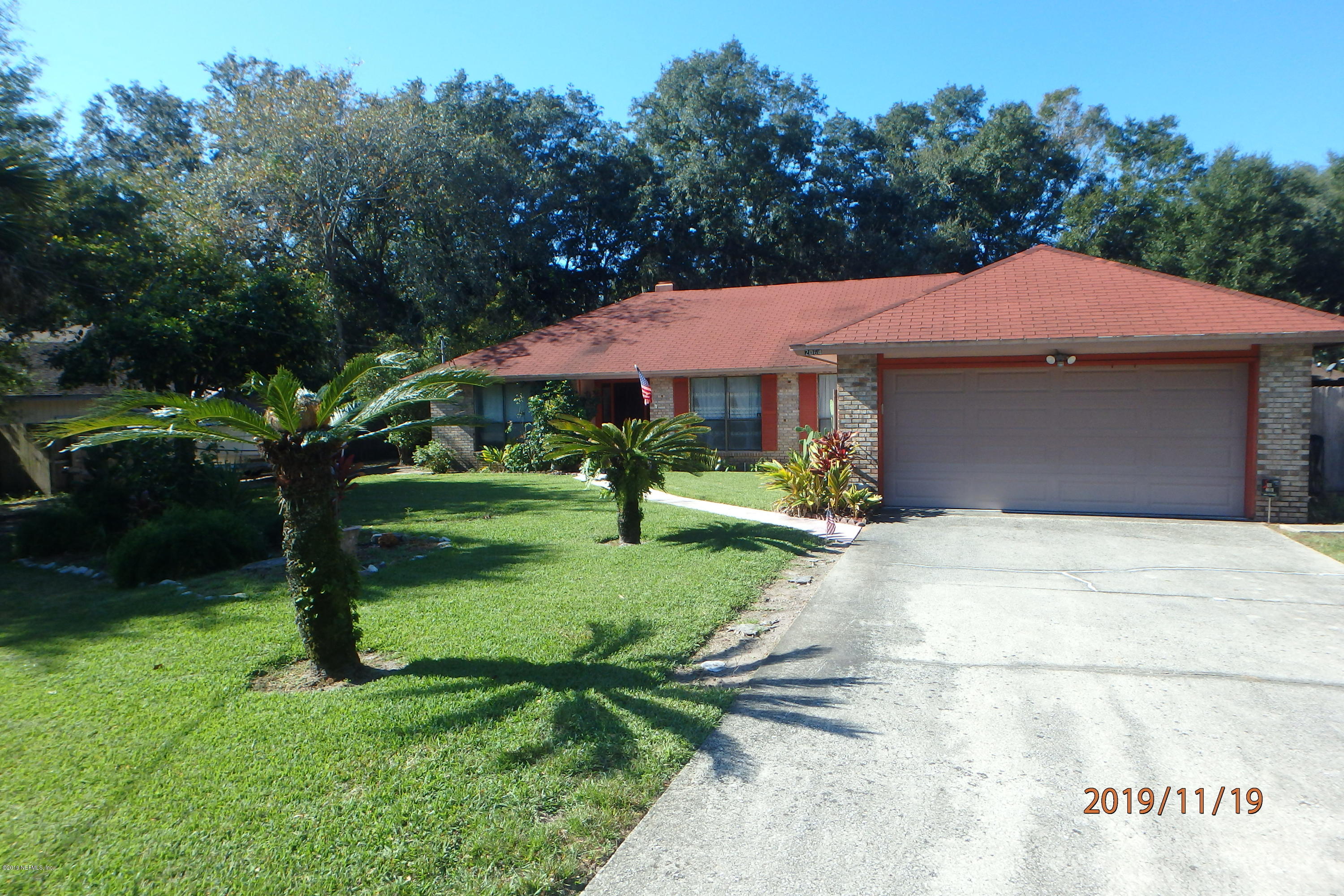 2064 Derringer Road Jacksonville, FL 32225 - Photo 2 of 17 a front view of a house with garden